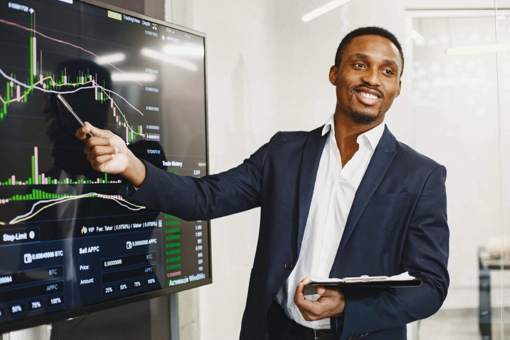 Sales Manager presents financial data using graphs, showcasing technology and analysis in a corporate environment