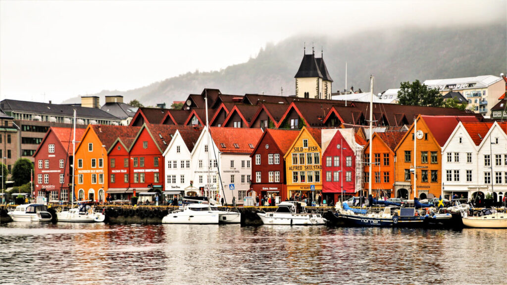 Charming waterfront of Bergen showcasing vibrant historic buildings and boats