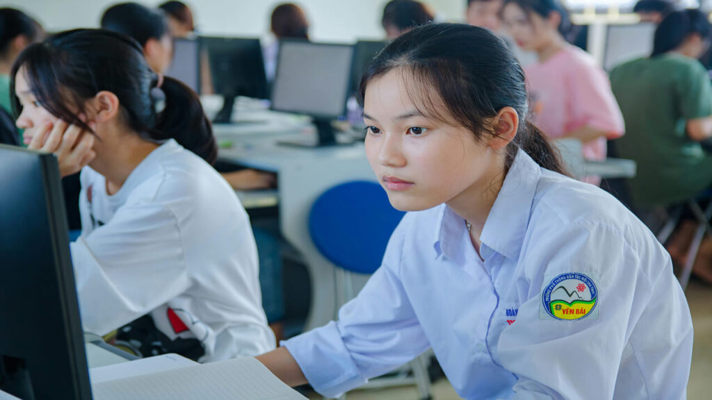 Young students studying computer science
