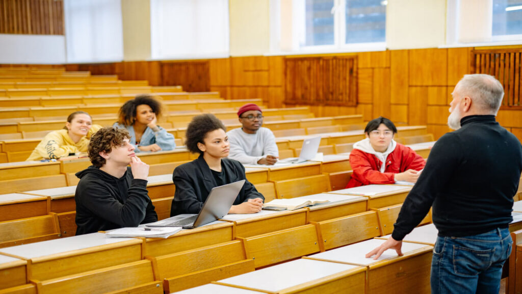 University students engaging in a diverse classroom setting with a lecturer