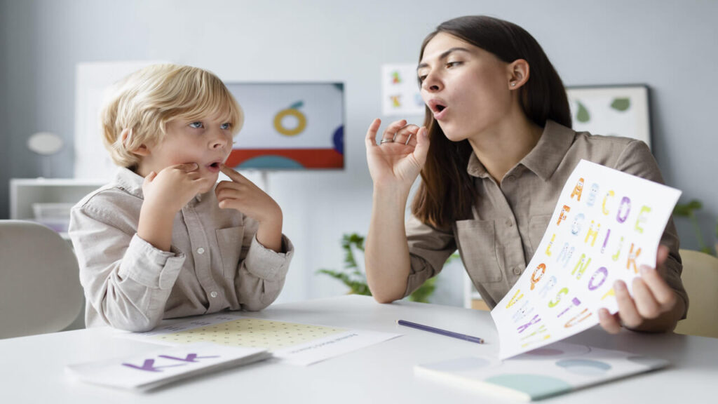 woman-doing-speech-therapy-with-little-boy